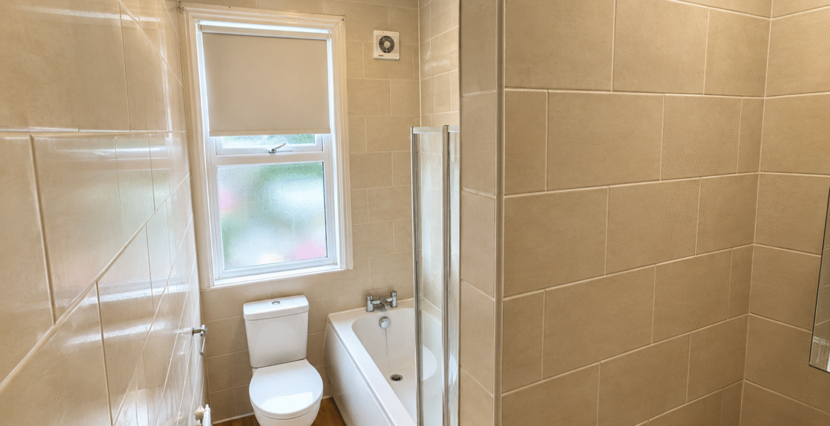 Bright Modern Beige Tiled Bathroom