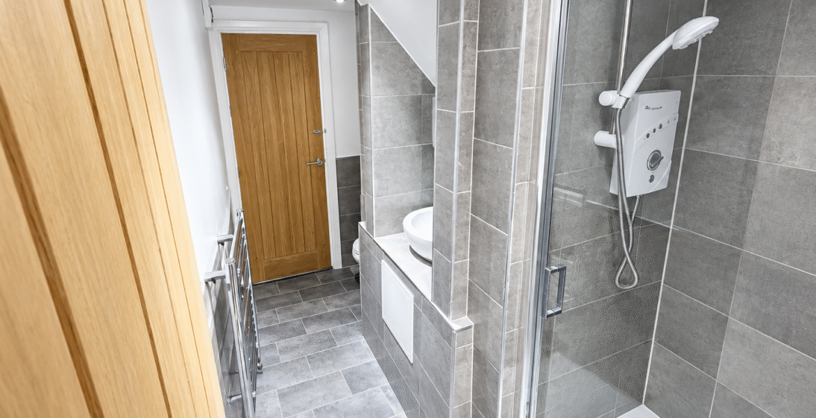 Modern Grey-Tiled Bathroom Corridor
