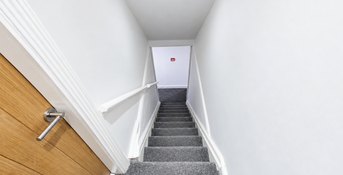 Modern Stairway with Red Fire Alarm