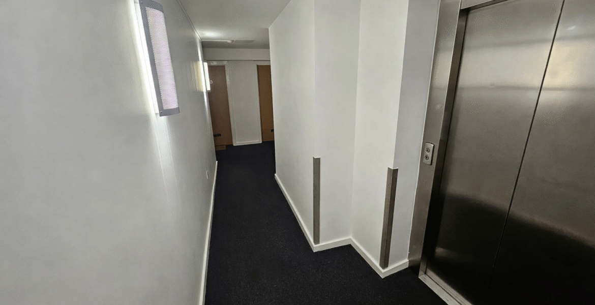 Modern corridor with stainless steel elevator