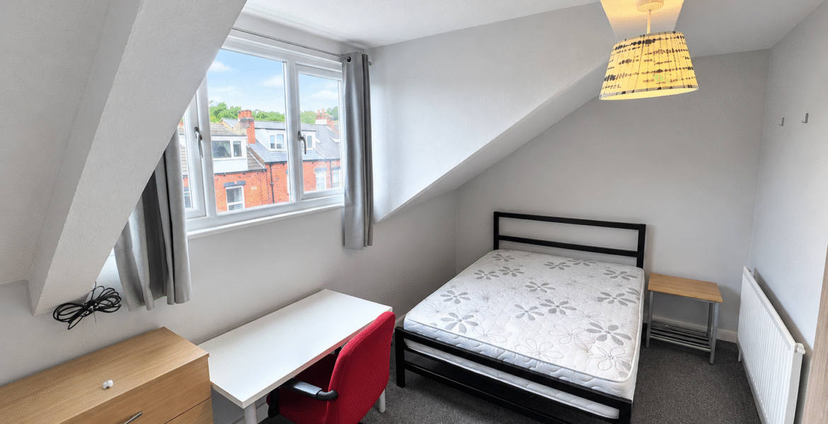 Tidy Attic Bedroom with Dormer Window