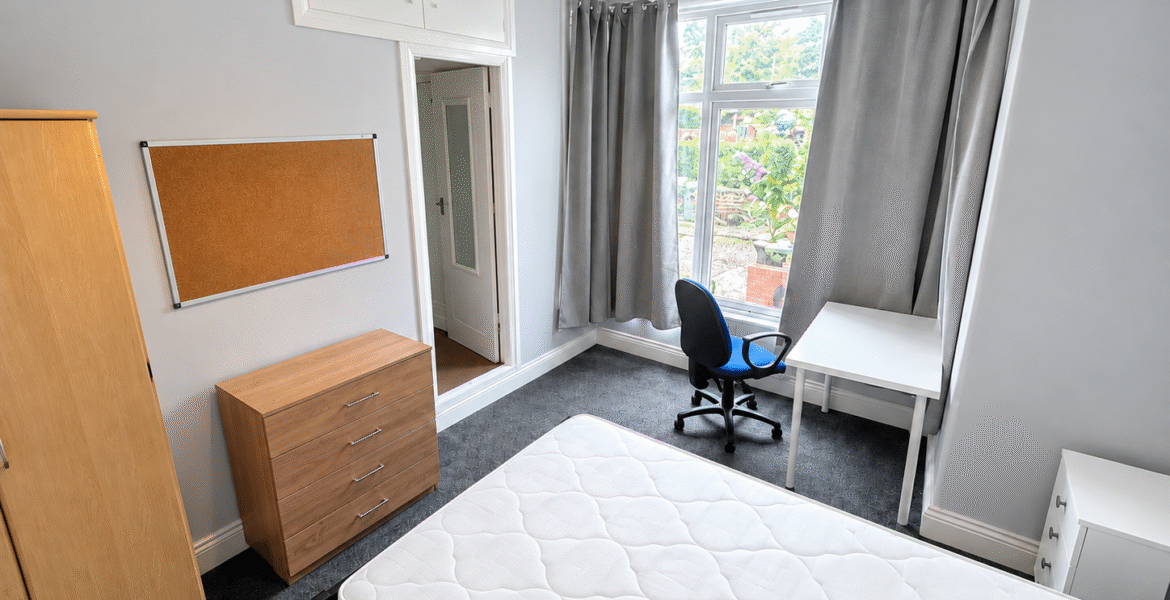 Tidy Bedroom with White Quilted Mattress
