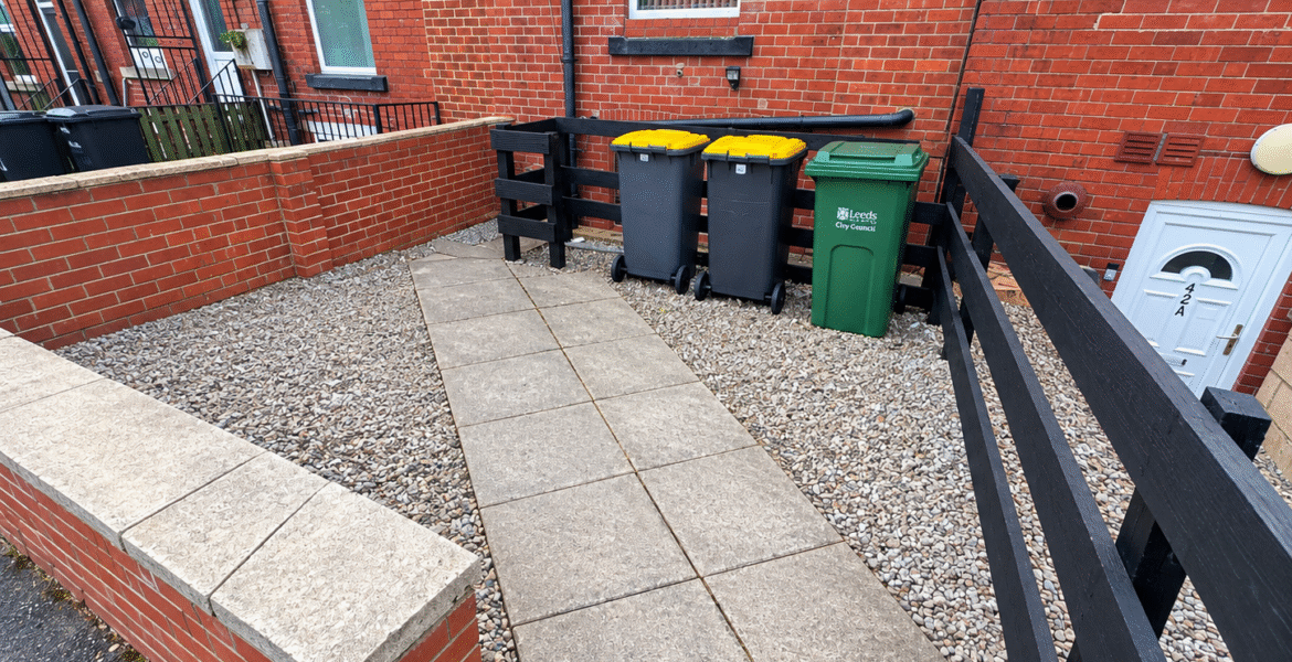Tidy Terraced House Courtyard with Bins